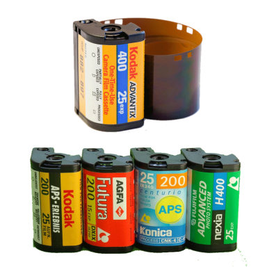 Variety of film canisters including Kodak and Agfa, with one canister unwrapped.